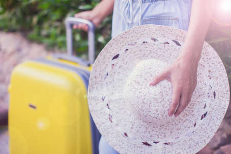 Woman with luggage outdoor. Travel, holiday and lifestyle conceptの写真素材