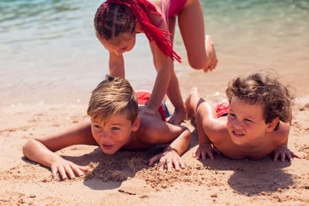 Kids on beach. Childhood, vacation and summer conceptの写真素材