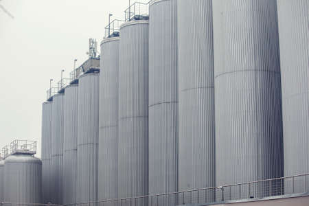Contemporary large steel barrels in winery. Vine industry