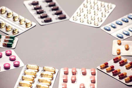 Capsules pill in blister packaging. Pharmaceutical industry concept. Pharmacy drugstore. Antibiotic...