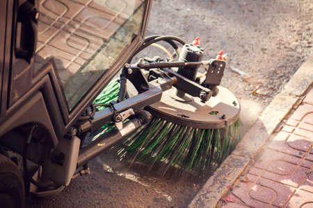 Street cleaning machine with truck brushes. Close up shot.の写真素材