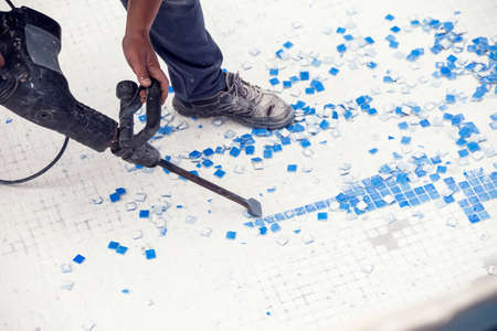 Removing tile in the pool, renovation work of swimming poolの写真素材