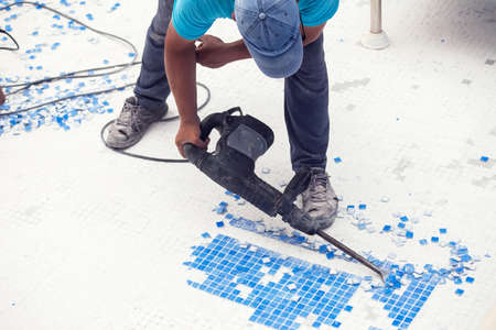 Removing tile in the pool, renovation work of swimming poolの写真素材