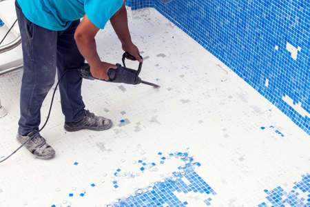 Removing tile in the pool, renovation work of swimming poolの写真素材