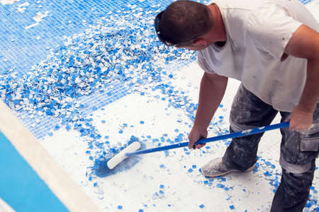 Removing tile in the pool, renovation work of swimming poolの写真素材