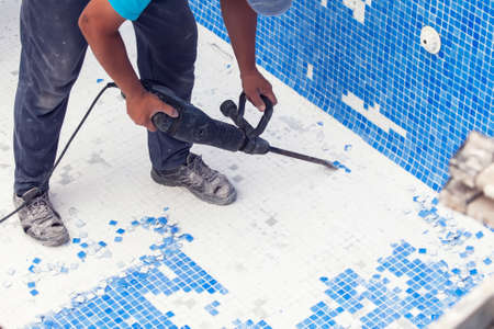 Removing tile in the pool, renovation work of swimming poolの写真素材