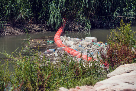 Barrier to stop floating garbage in the river. Environmental protection and ecology conceptの写真素材