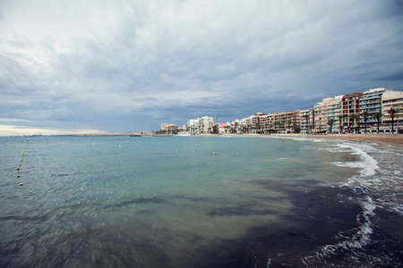 Torrevieja, Spain, 27.04.2021, Sandy beach of Mediterranean sea in Torrevieja city, Costa Blancaの写真素材