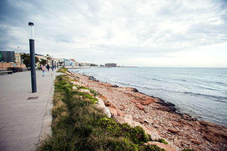 Torrevieja, Spain, 27.04.2021, Sandy beach of Mediterranean sea in Torrevieja city, Costa Blancaの写真素材