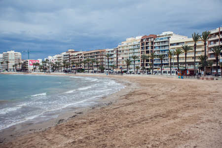 Torrevieja, Spain, 27.04.2021, Sandy beach of Mediterranean sea in Torrevieja city, Costa Blancaの写真素材