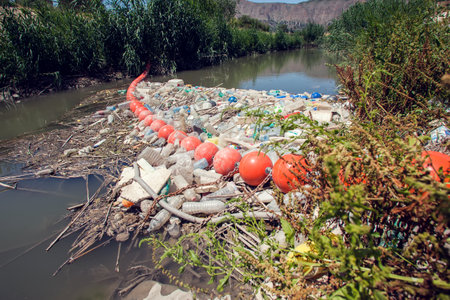 Barrier to stop floating garbage in the river. Environmental protection and ecology conceptの写真素材