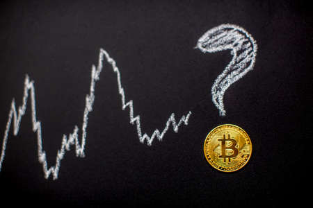 Bitcoin and question mark on chalkboard. Cryptocurrency concept.の写真素材
