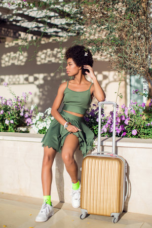 Woman tourist with suitcase luggage. Business travel, student lifestyle, people, tourism conceptの写真素材