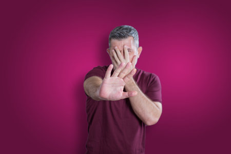 Scared and afraid man. Expressing the emotion of fearの写真素材