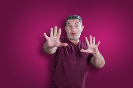 Scared and afraid man. Expressing the emotion of fearの写真素材