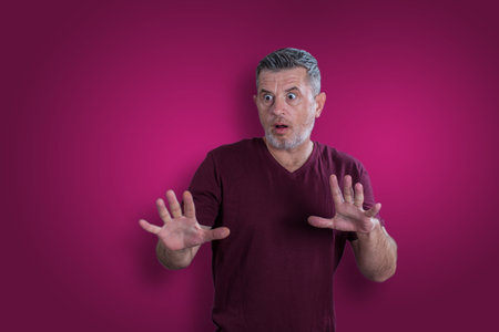 Scared and afraid man. Expressing the emotion of fearの写真素材