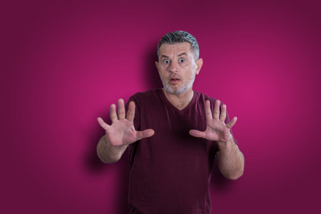 Scared and afraid man. Expressing the emotion of fearの写真素材