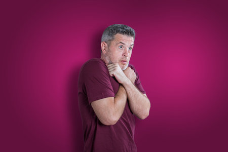 Scared and afraid man. Expressing the emotion of fearの写真素材