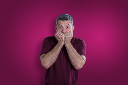 Scared and afraid man. Expressing the emotion of fearの写真素材