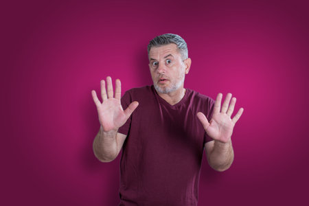 Scared and afraid man. Expressing the emotion of fearの写真素材