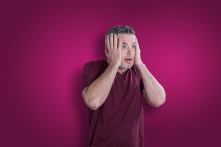 Scared and afraid man. Expressing the emotion of fearの写真素材
