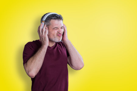 Man with headphones listen to music with closed eyes.の写真素材