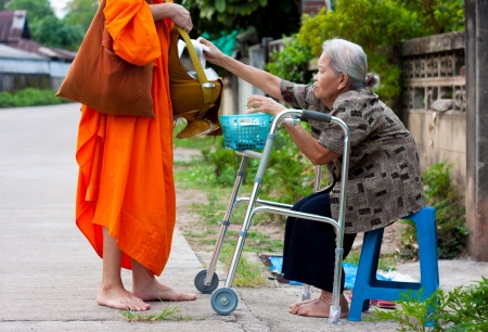 the old woman alms to noviceのeditorial素材