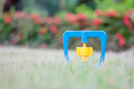 closed up sprinkler in the lawnの写真素材