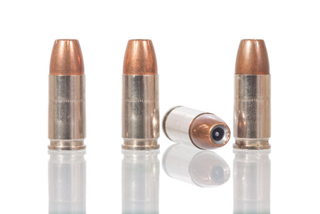 9mm bullet with shadow isolated on white 