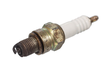 used and dirty sparking plug isolated on white