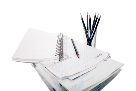 Pile of documents stack up with note book and pencil  isolated on white