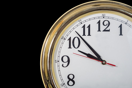 a part of clock isolated on blackの写真素材