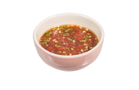 seafood sauce in ceramic bowl isolated on whiteの写真素材