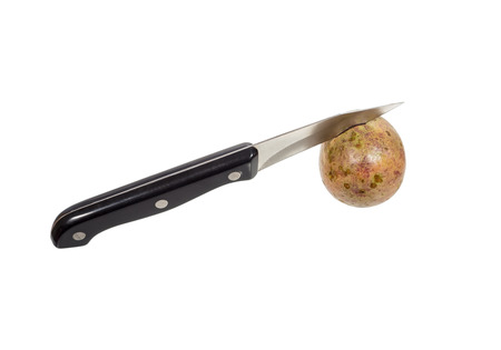 knife cut the passion fruit isolated on white