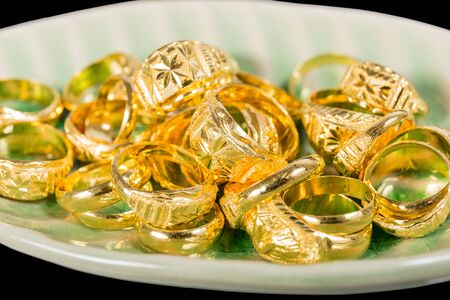 closed up of golden ring in ceramic plateの写真素材