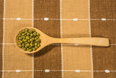 green bean in wooden spoonの写真素材