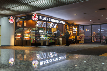 Exterior of a Black Canyon coffee store at passenger hall  Don Muang International Airport on November 9, 2015 in Bangkok, Thailand.のeditorial素材