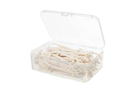 floss toothpick in plastic container isolated on whiteの写真素材