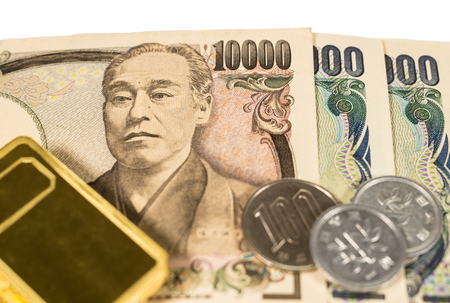 gold coin and banknote isolated on whiteの写真素材
