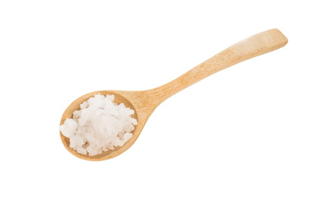 sea salt on wooden spoon isolated on whiteの写真素材