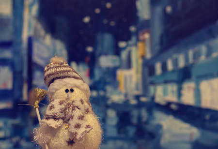Snowman in the city. Christmas night.  Christmas decoration.の写真素材