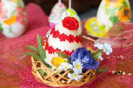 Decorated Easter candles in the form of eggs.