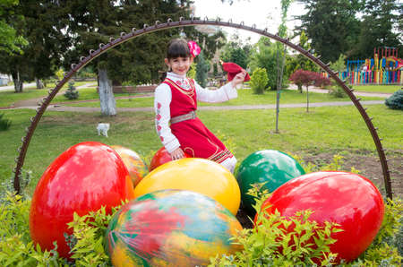 Veliko Tarnovo, Bulgaria - April 28.2016: A child with traditional costumes of the region celebrate Easter.のeditorial素材