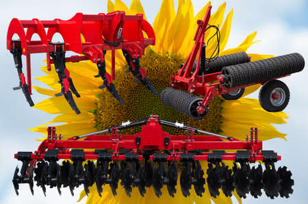 Farm equipment and implements - disc harrow, subsoiler, flat lifter and roller tractor trailer.の写真素材