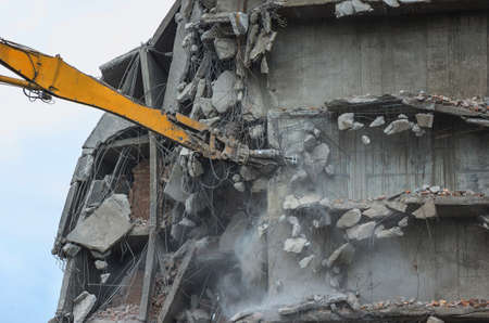Removing a building with a excavator