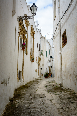 A narrow alley in Ostuni, Puglia, Italyの写真素材