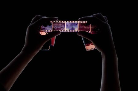 Two hands with photo filmの写真素材