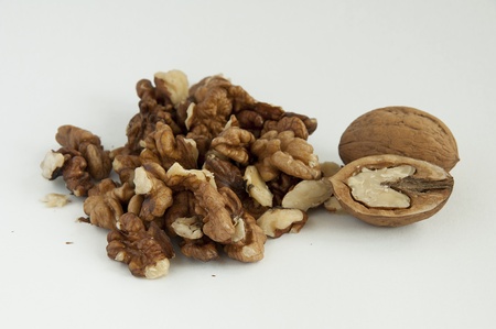 Walnuts on white background, one entire and others separatedの写真素材
