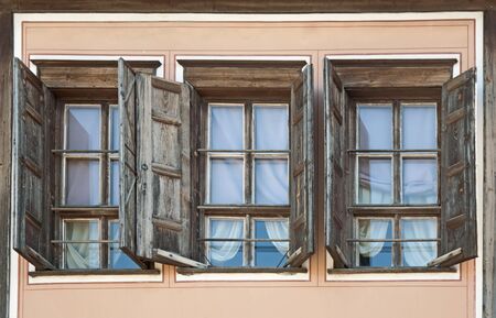 Three old windowsの写真素材