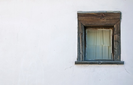 Old windows on the white wallの写真素材